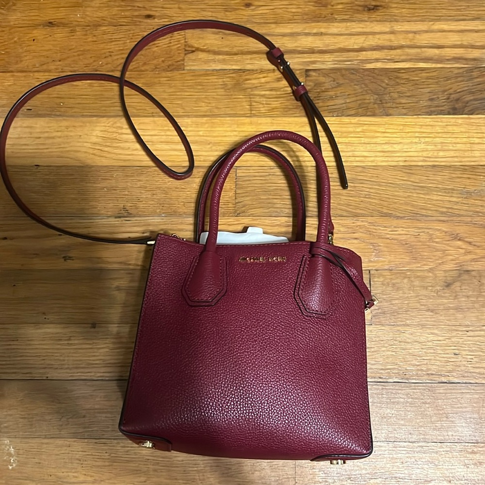 Michael Kors with tags. Women's Burgundy Handbag. 8 in by 9 in.